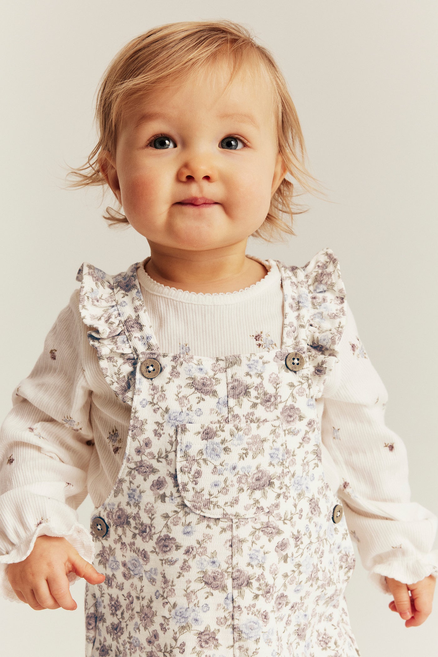 Baby white floral dungarees with frills