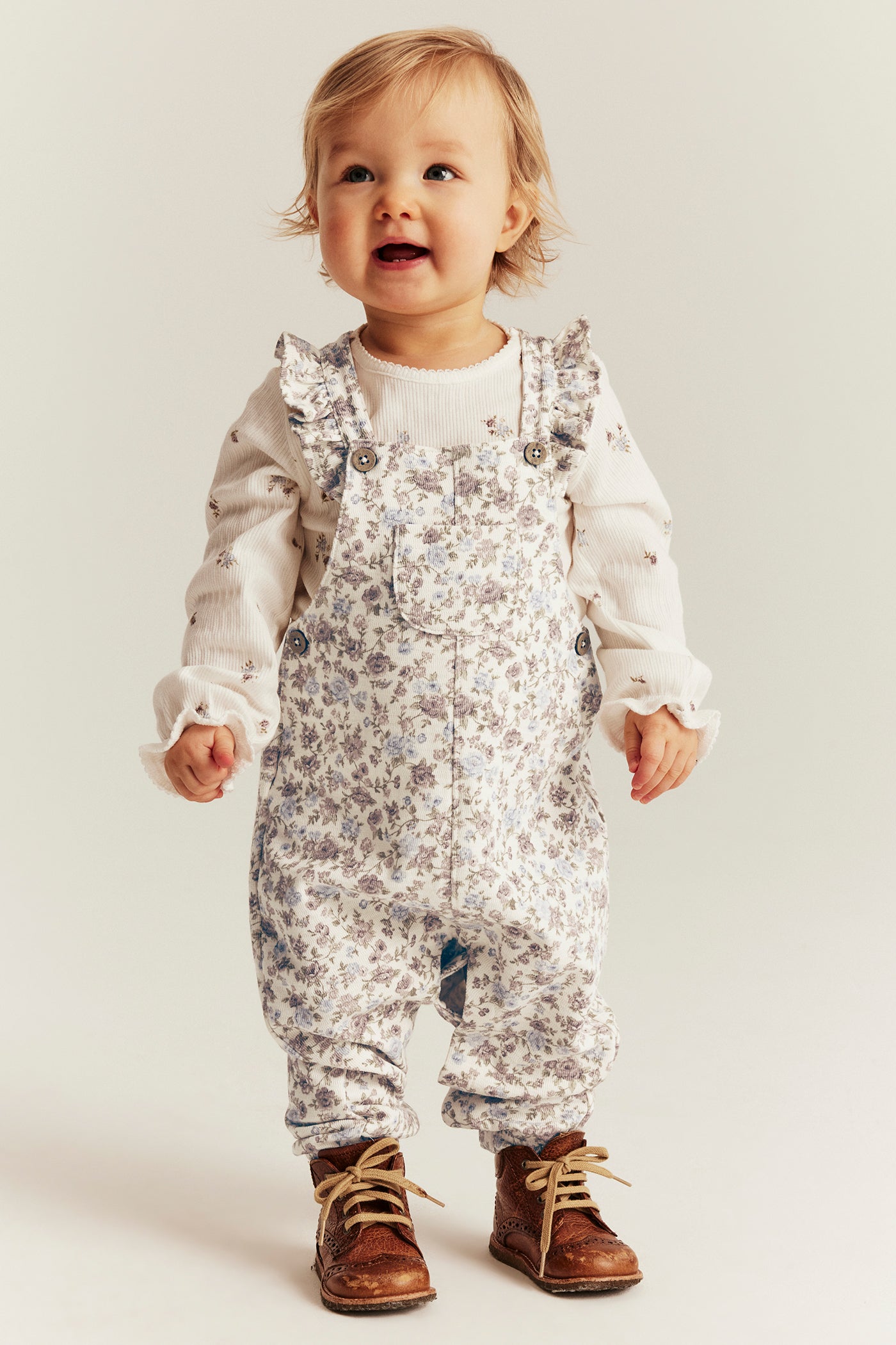 Baby white floral dungarees with frills