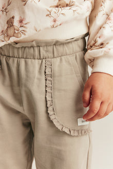 Kids’ beige joggers with lace details