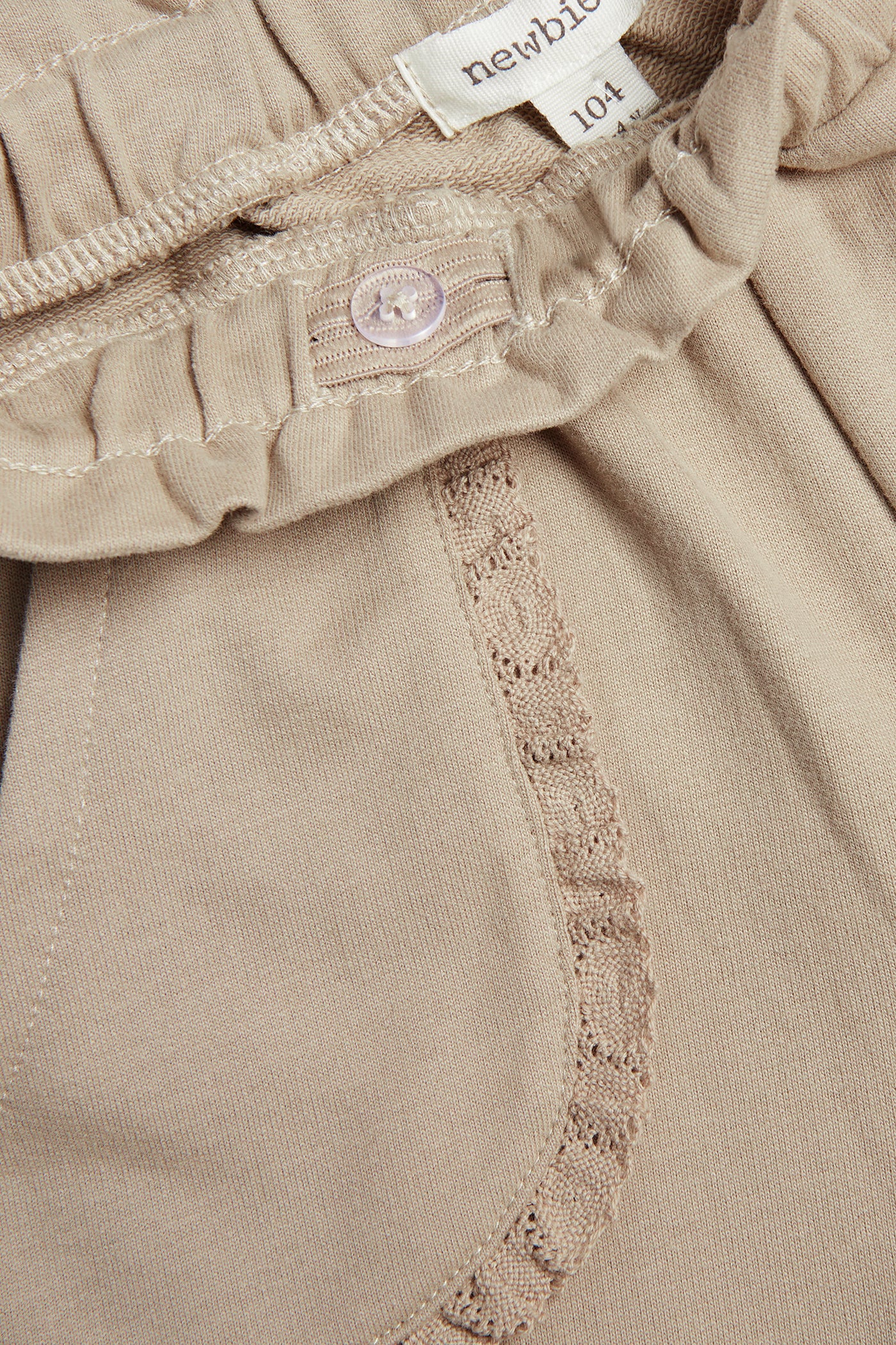 Kids’ beige joggers with lace details
