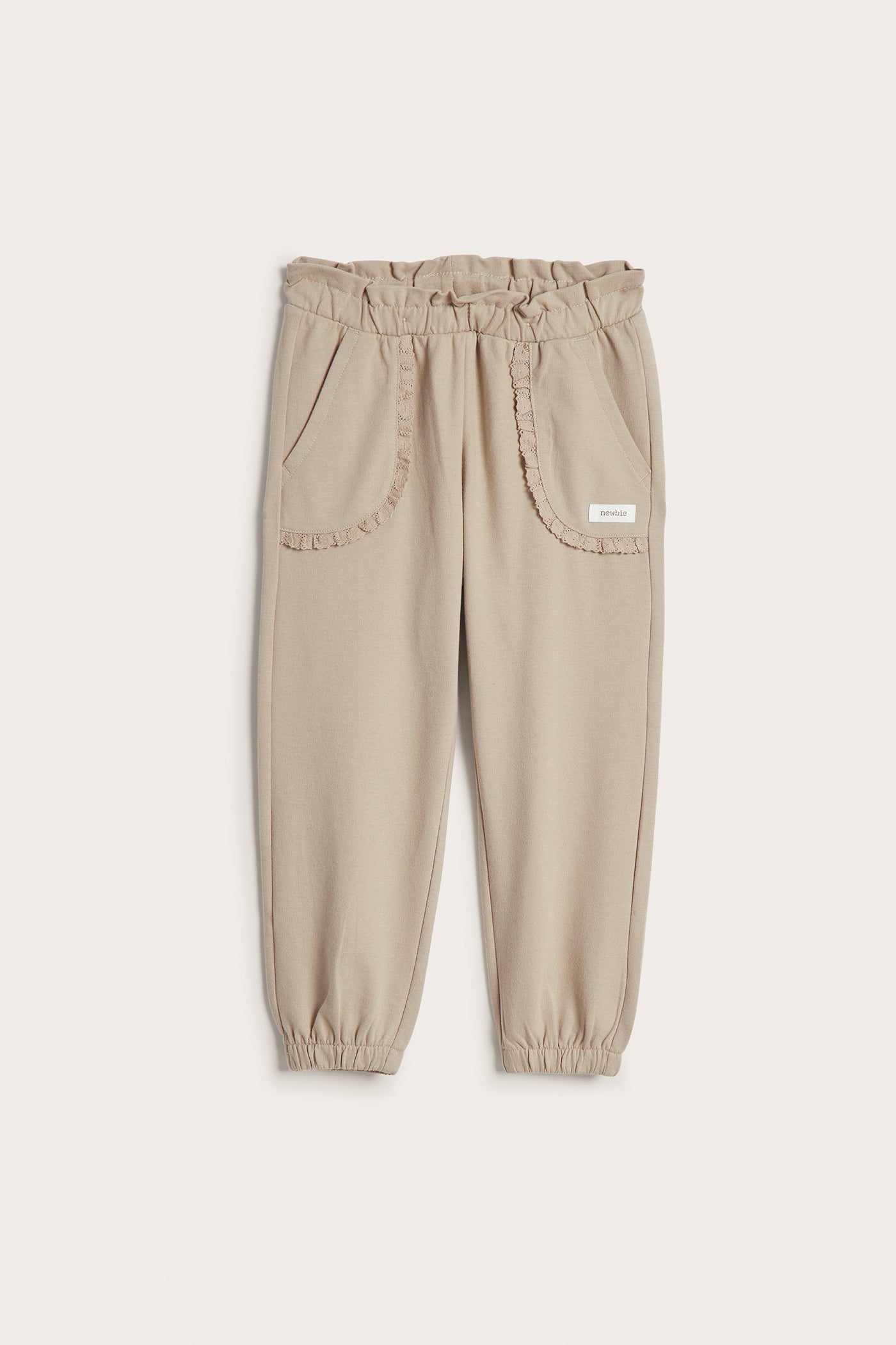 Kids’ beige joggers with lace details