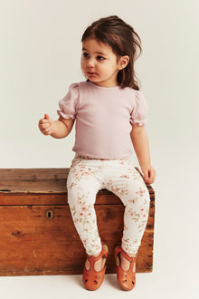 Baby pink bodysuit with short puff sleeves