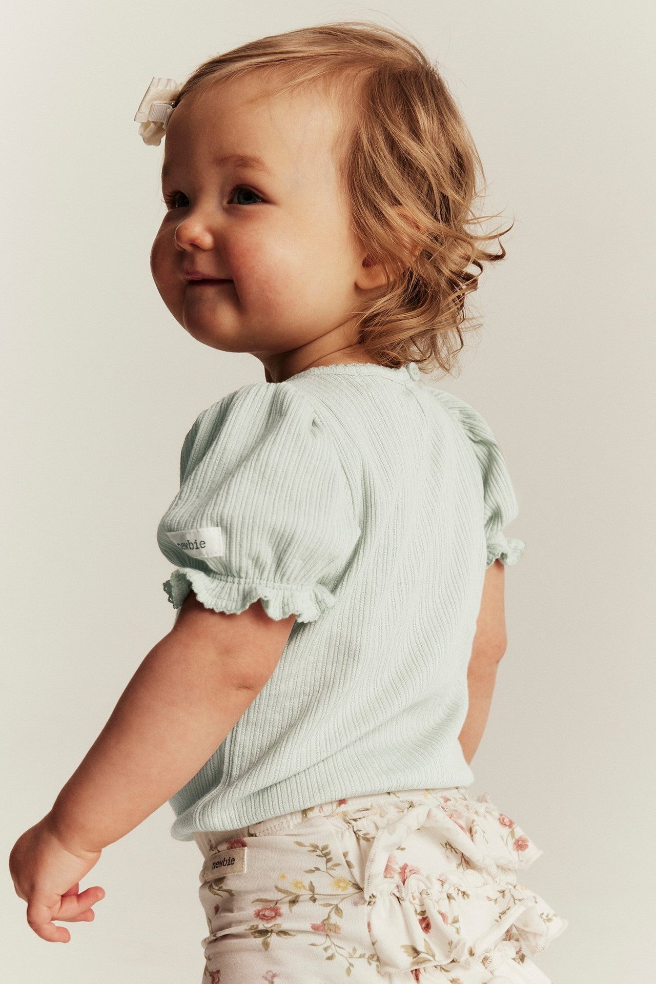 Baby green bodysuit with puff sleeves