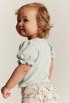 Baby green bodysuit with puff sleeves