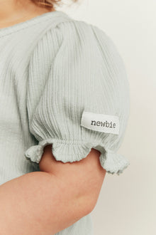 Baby green bodysuit with puff sleeves