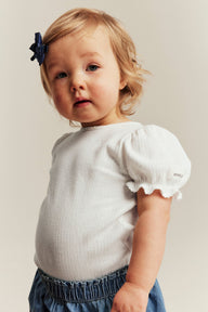 Baby white bodysuit with puff sleeves