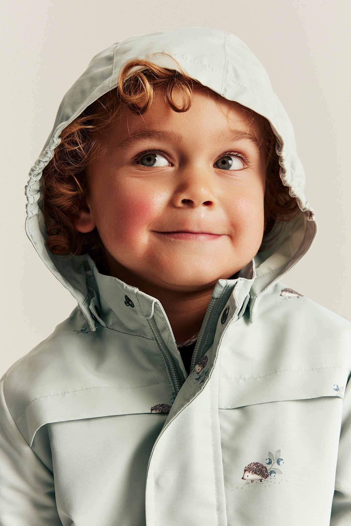 Baby & kids’ green windproof jacket with hedgehogs