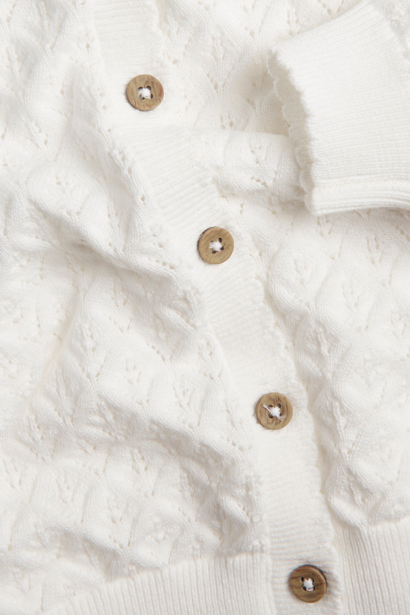 Baby white pattern‑knitted cardigan
