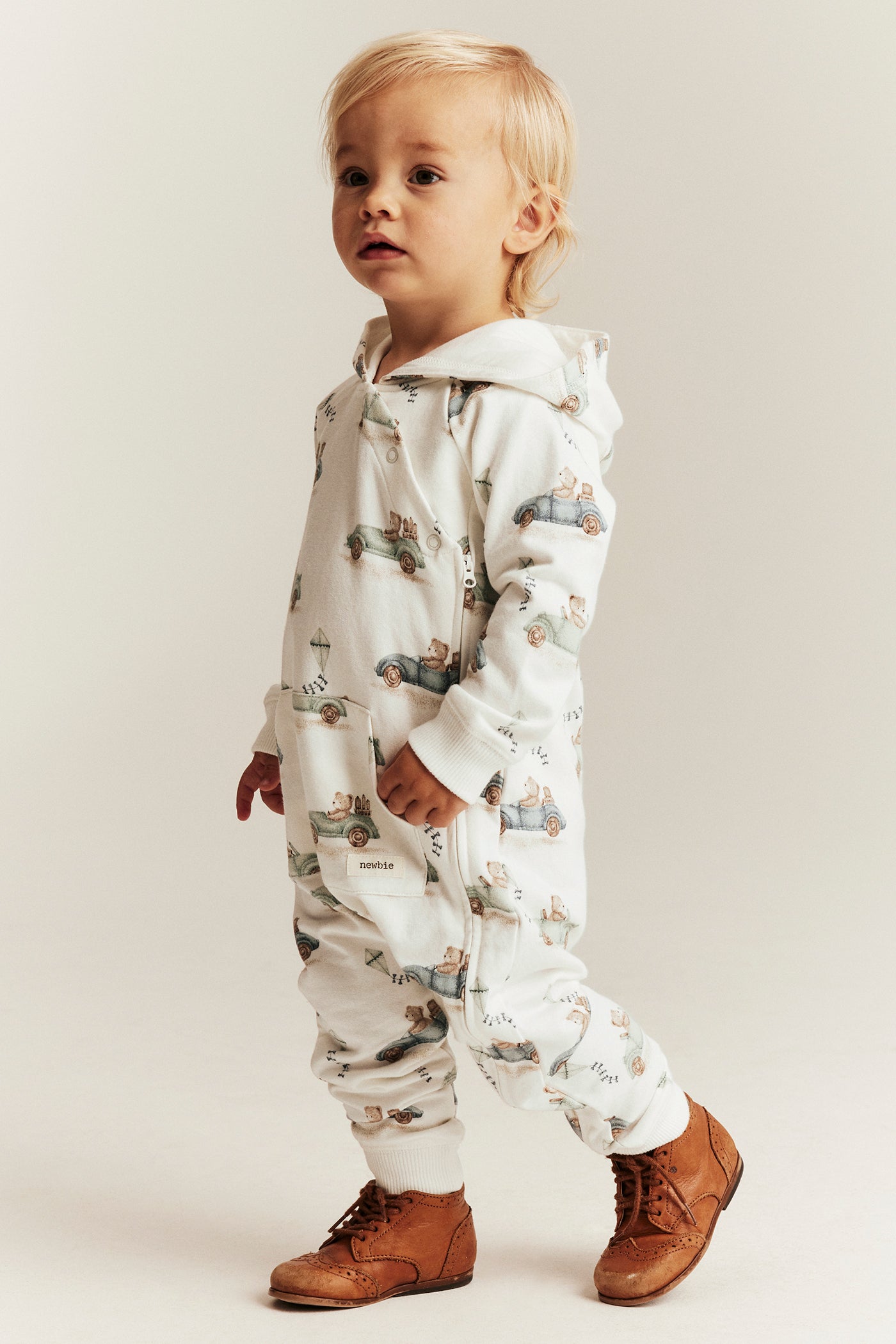 Baby white jumpsuit with car motif