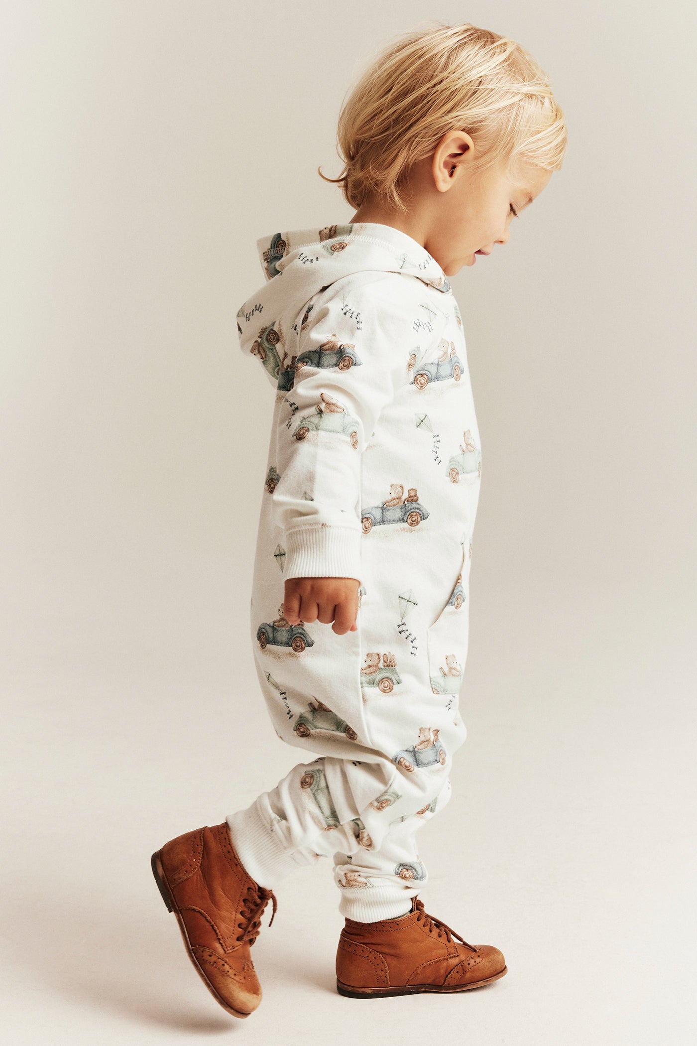 Baby white jumpsuit with car motif