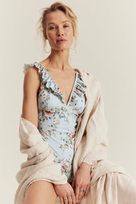 Women's blue floral swimsuit with frill detail