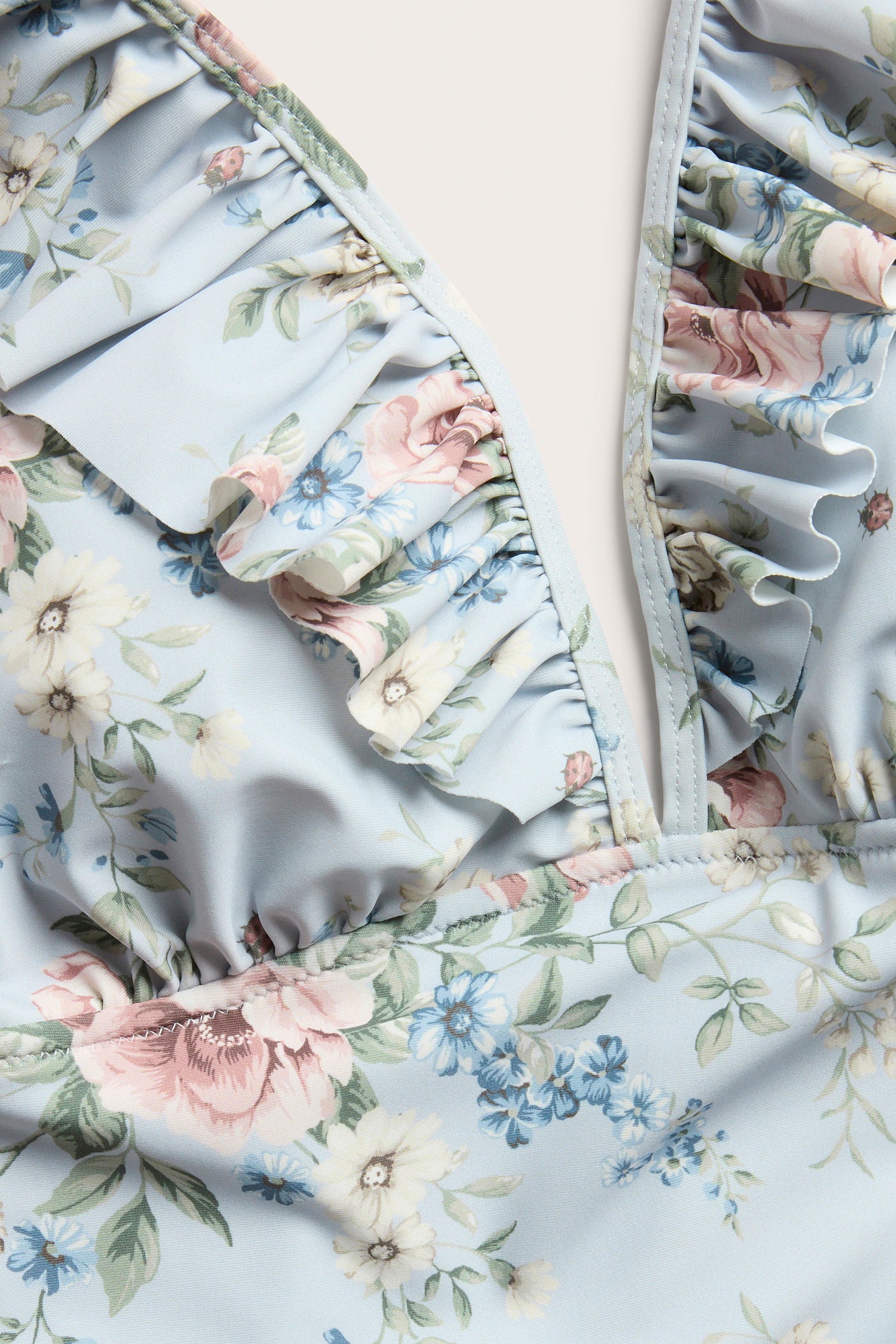 Women's blue floral swimsuit with frill detail