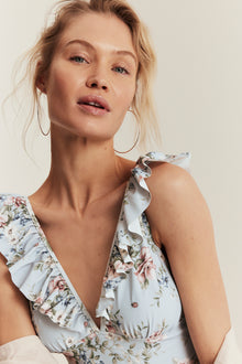 Women's blue floral swimsuit with frill detail