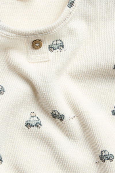 Baby white bodysuit with car motif