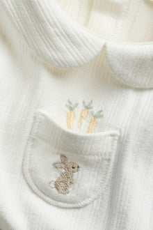 Baby white long-sleeved bodysuit with a collar