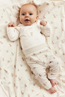 Baby white long-sleeved bodysuit with a collar