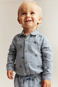 Baby blue shirt bodysuit with blueberries