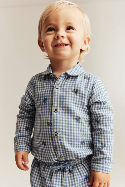 Baby blue shirt bodysuit with blueberries