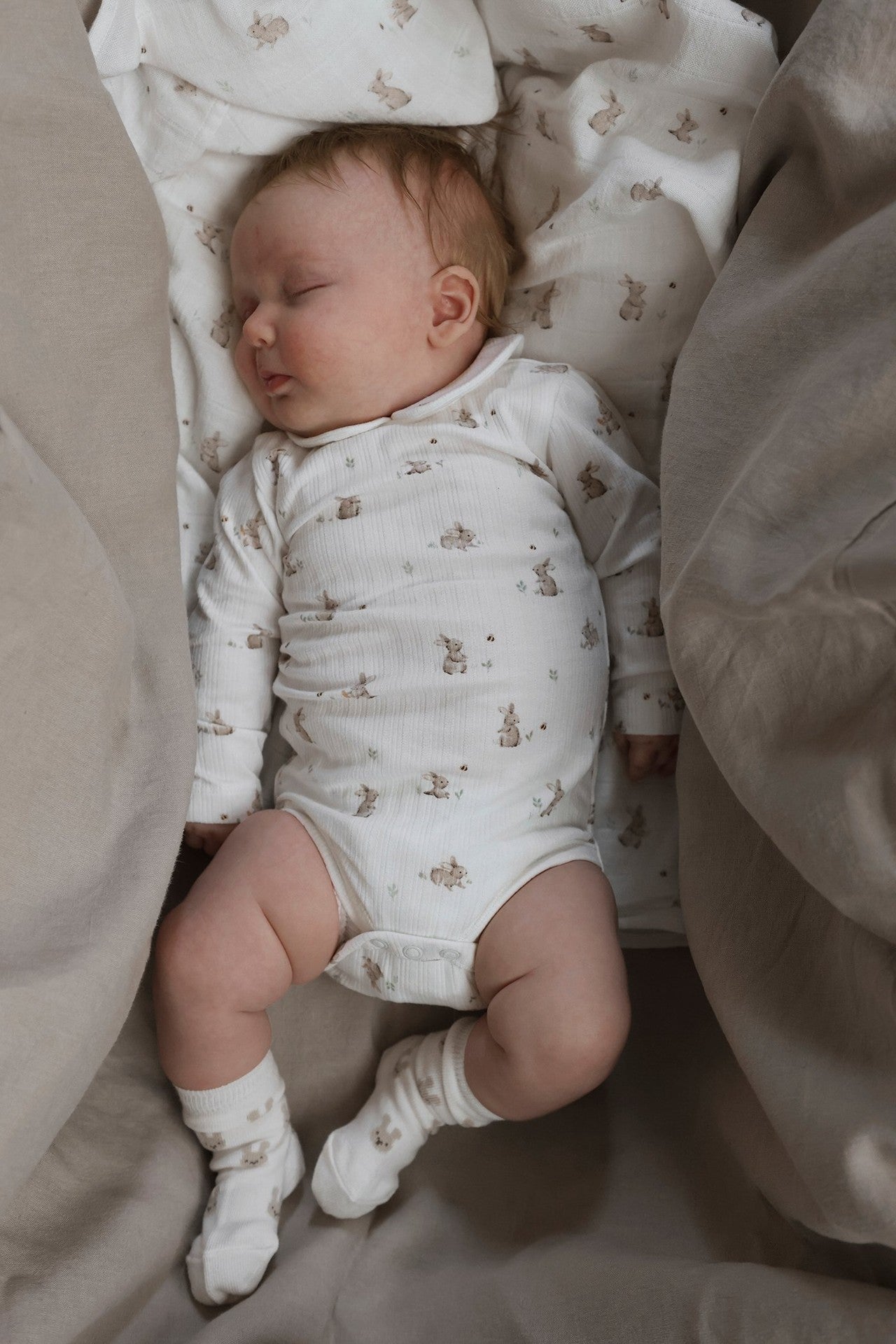 Baby white ribbed bodysuit with rabbits