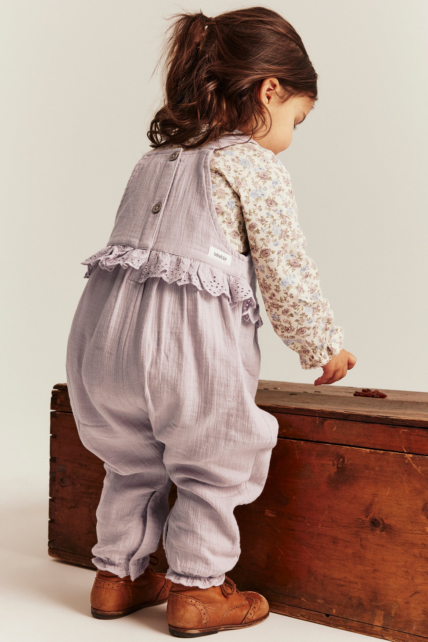 Baby purple dungarees with lace frill