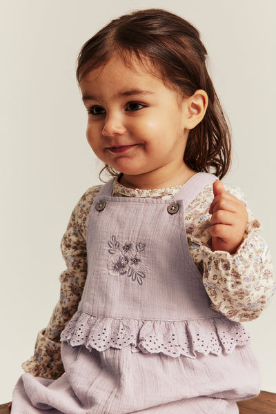 Baby purple dungarees with lace frill