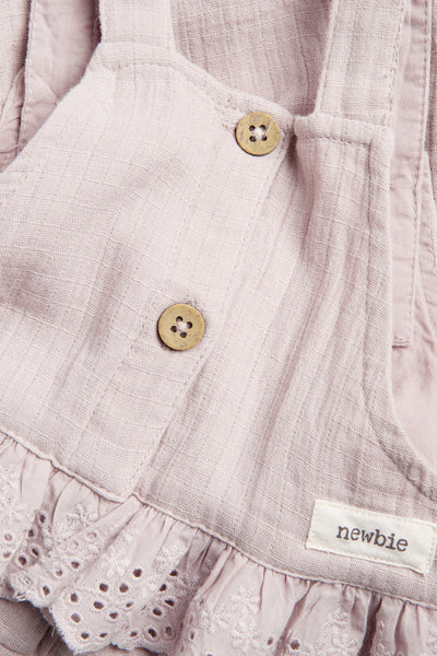 Baby purple dungarees with lace frill