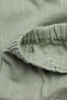 Baby green textured woven trousers