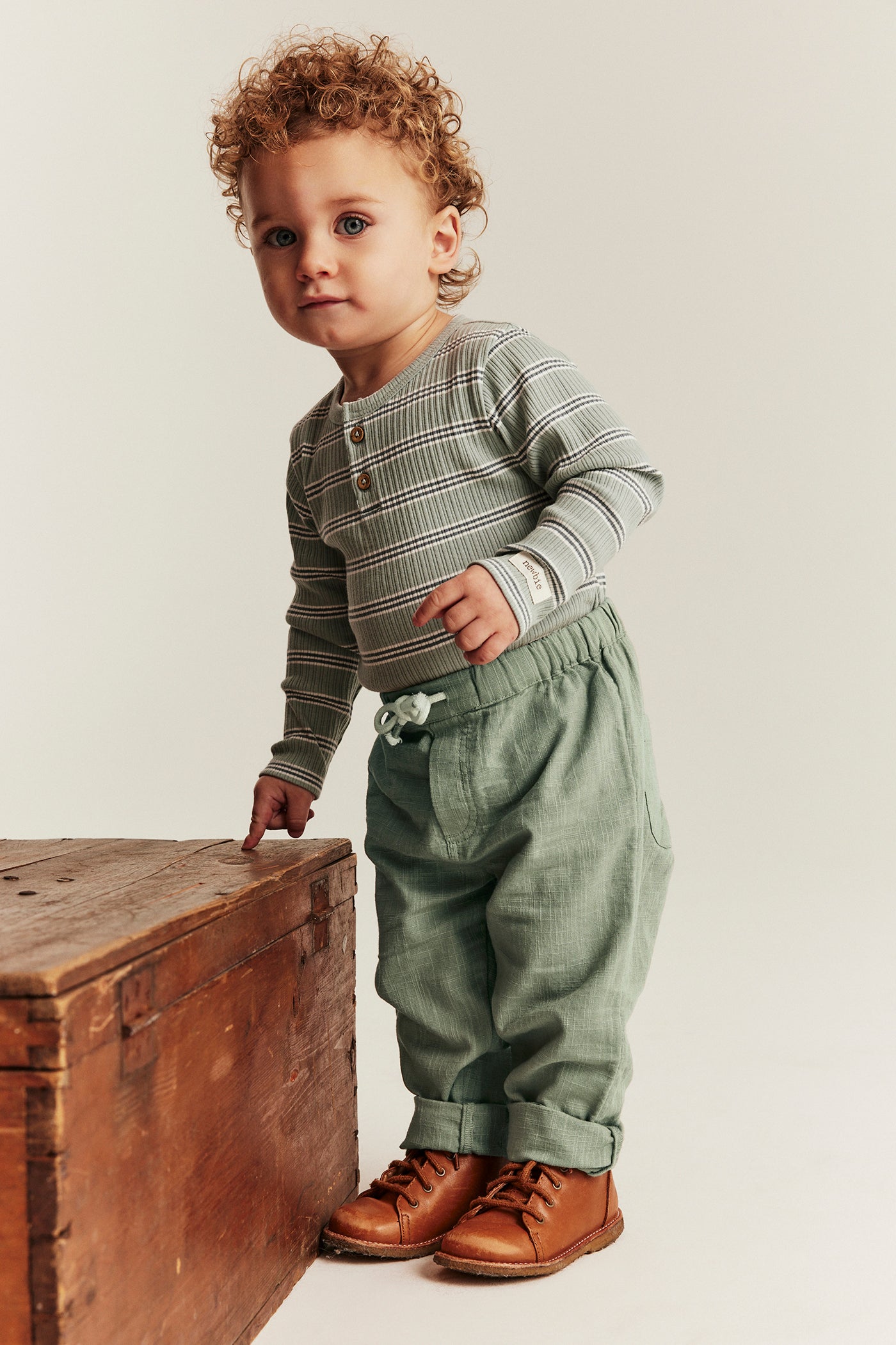 Baby green textured woven trousers