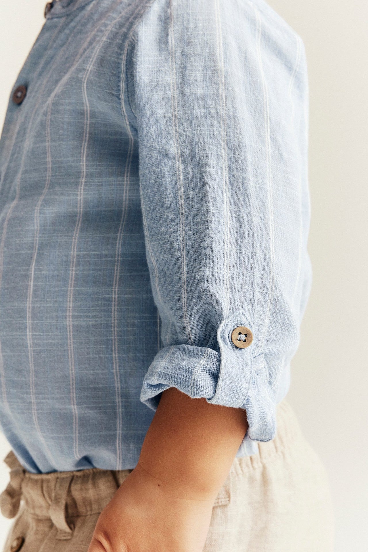 Baby blue striped shirt‑style bodysuit