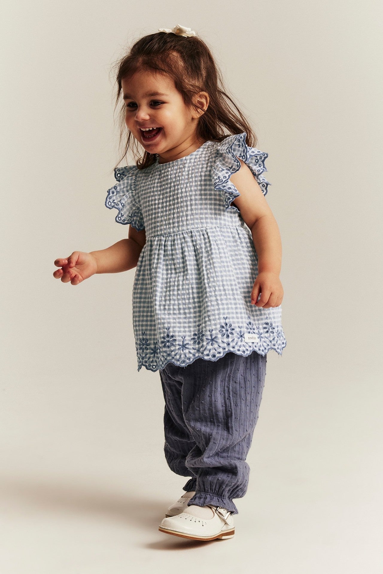 Baby checked bodysuit with frills and embroidery