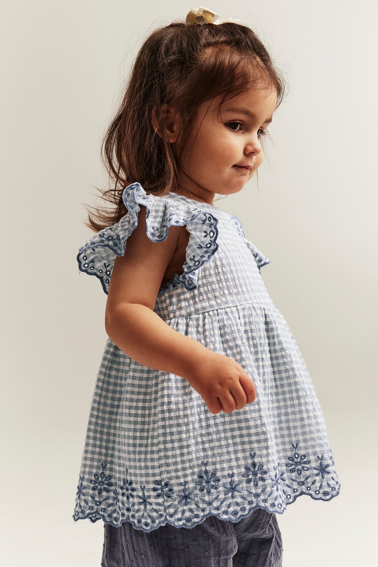 Baby checked bodysuit with frills and embroidery