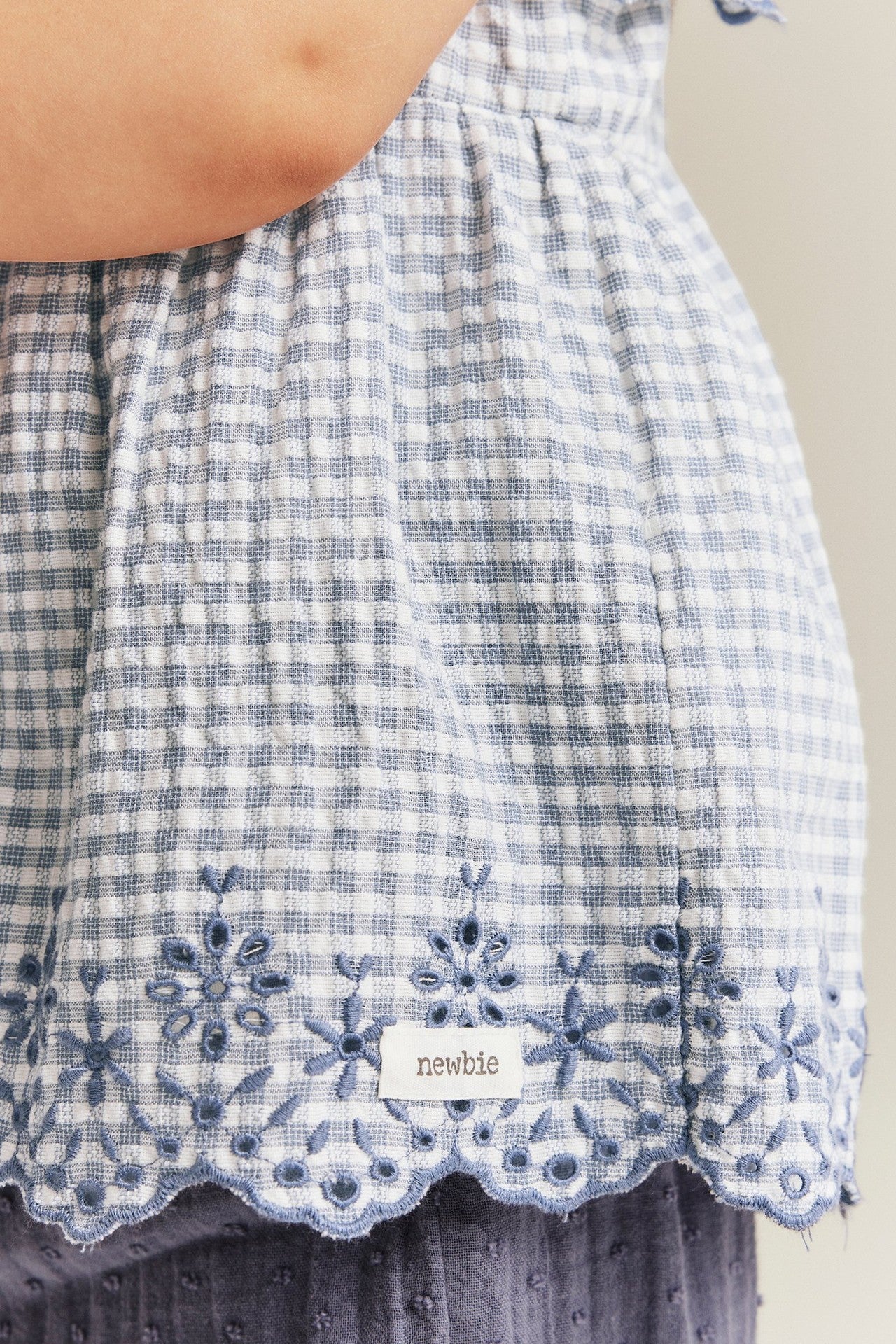 Baby checked bodysuit with frills and embroidery