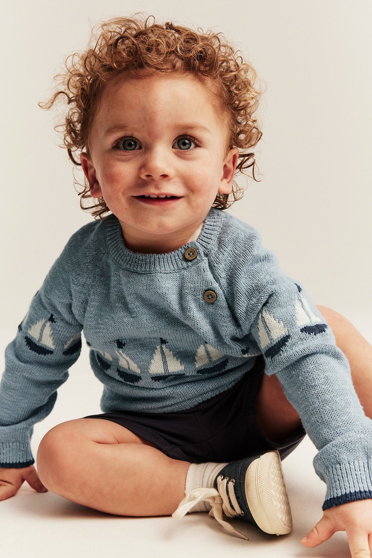 Baby knitted sweater with sailboats