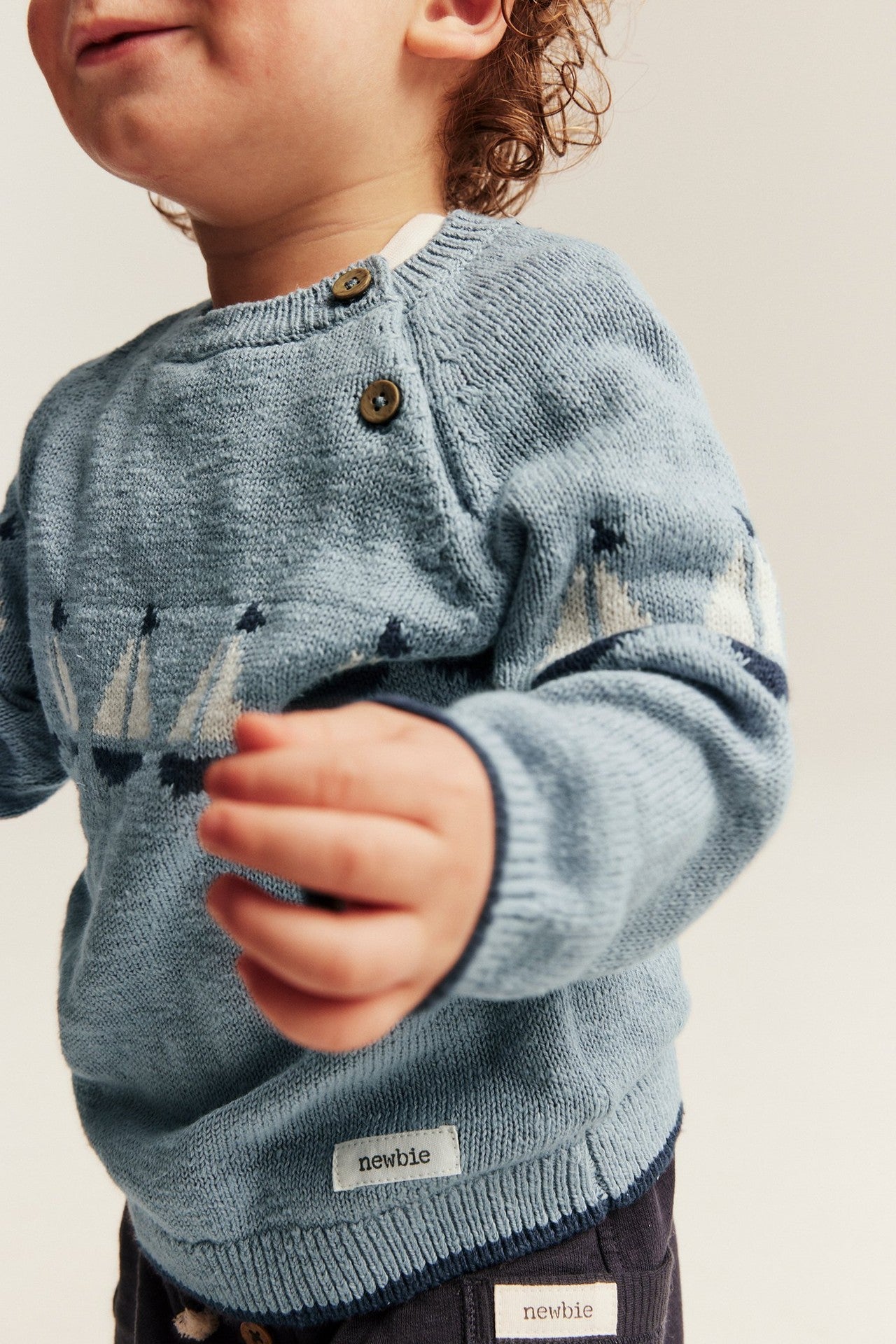 Baby knitted sweater with sailboats