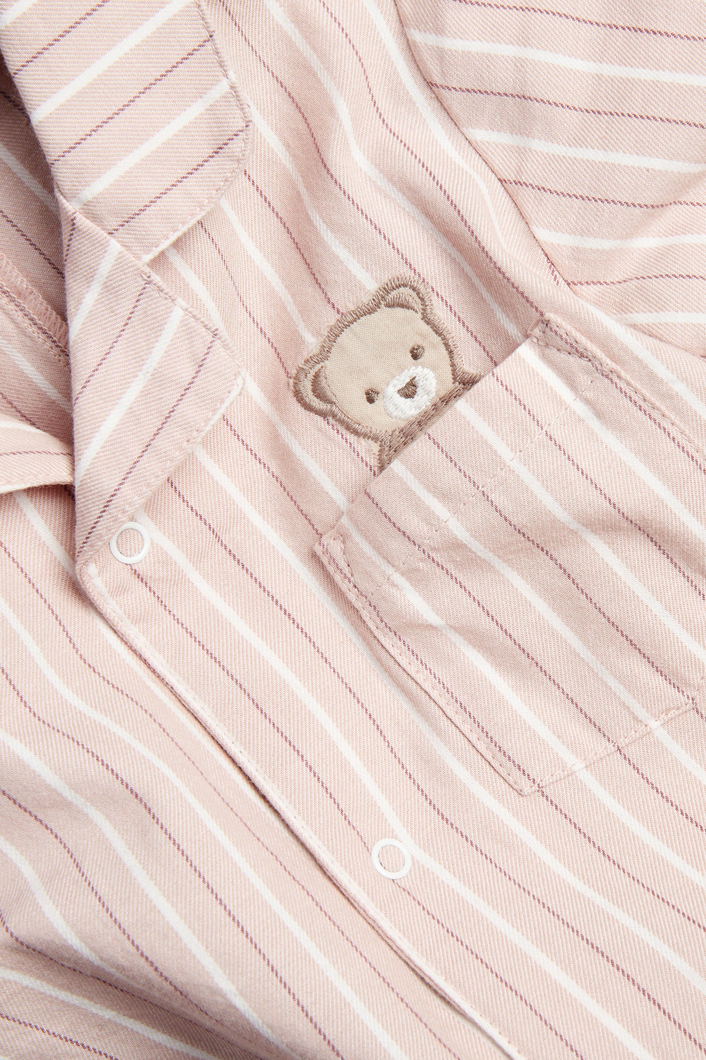 Baby pink striped sleepsuit with teddy bear