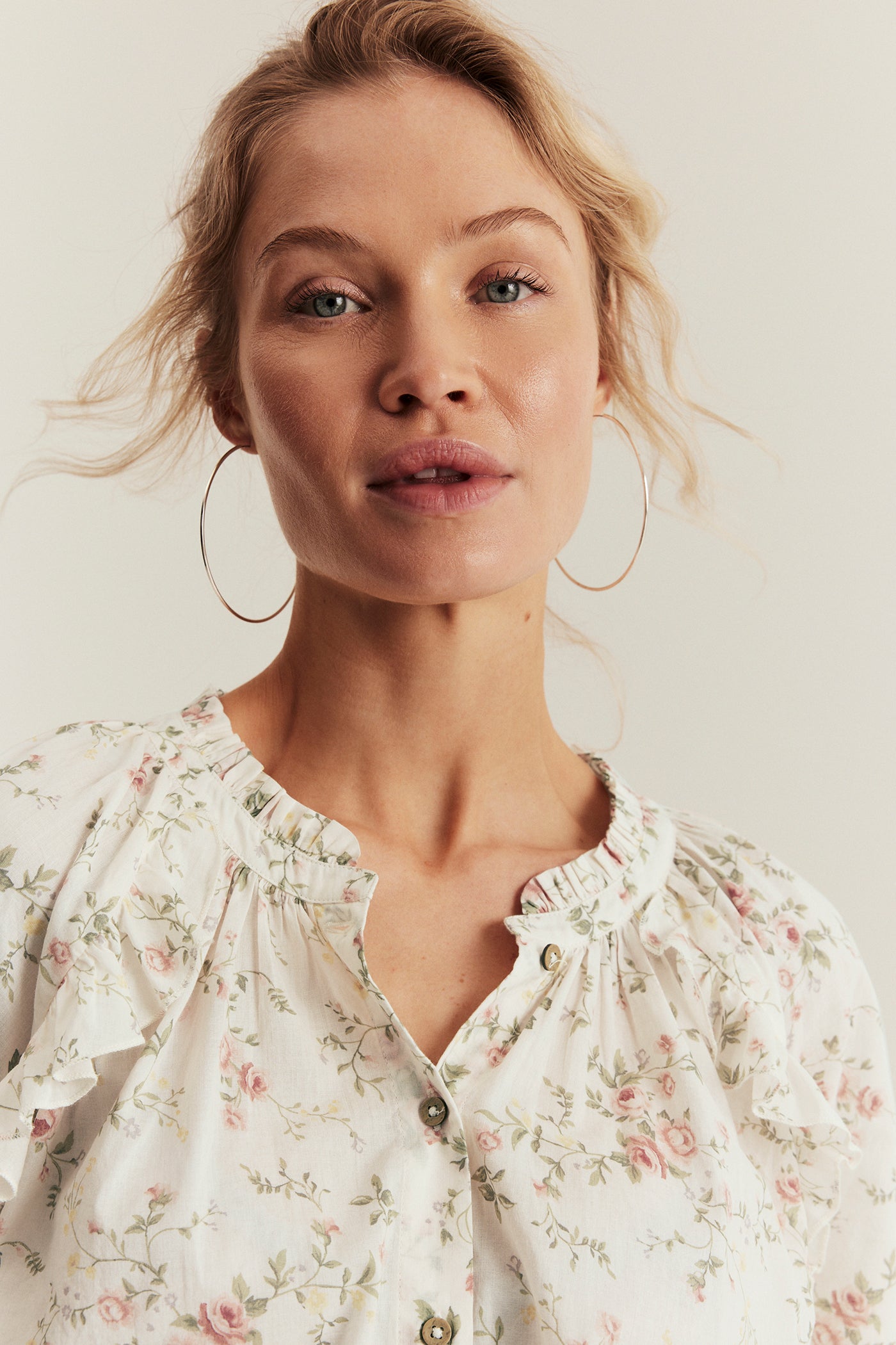 Women’s white floral blouse with frill