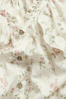 Women’s white floral blouse with frill