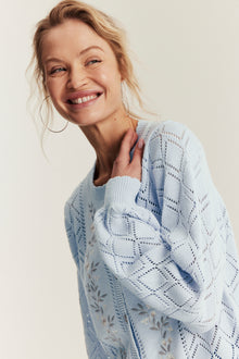 Women's blue knitted cardigan with flowers