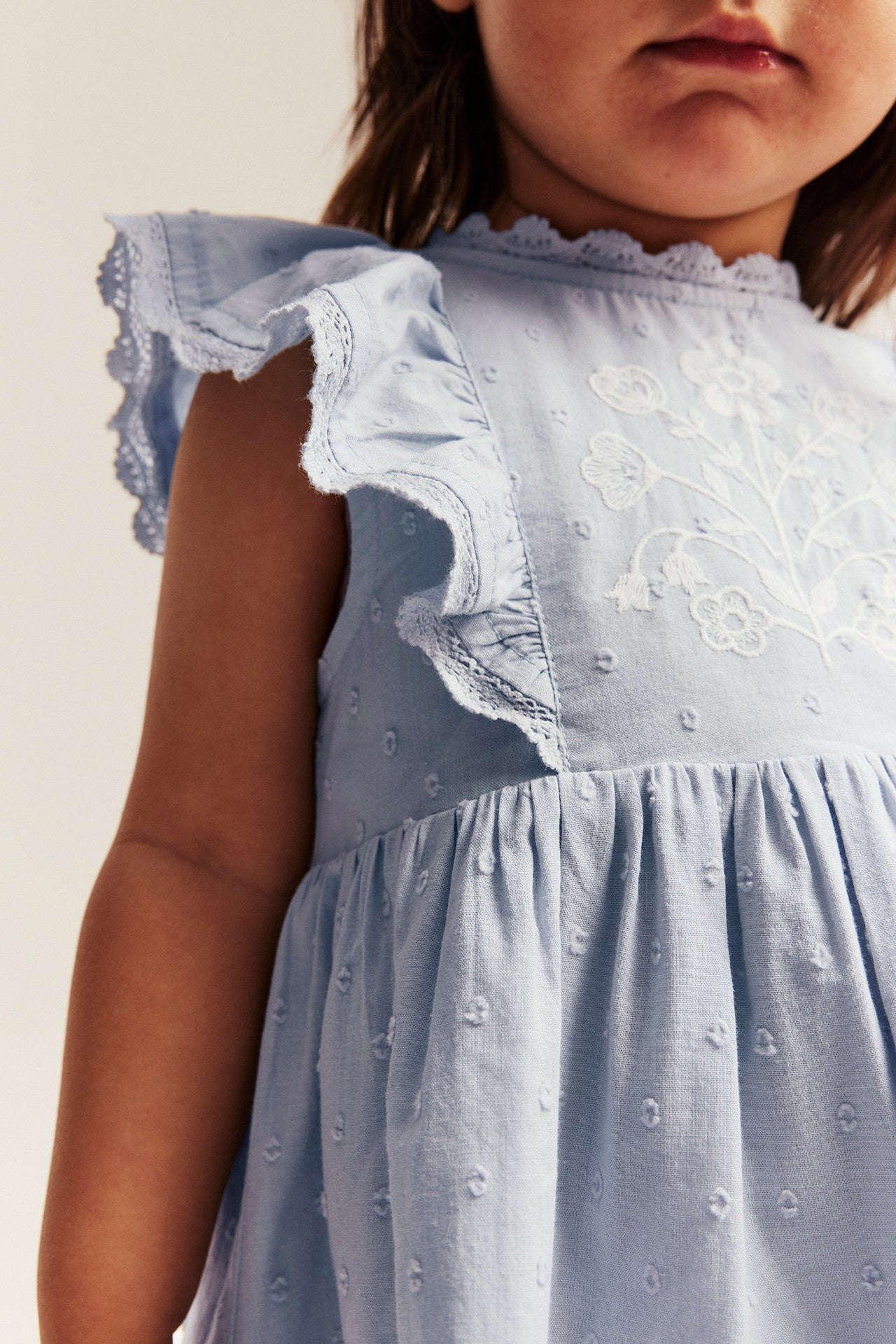 Baby blue dress with floral embroidery