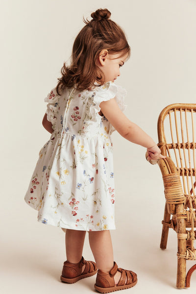 Baby white jersey dress with frill