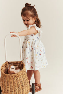 Baby white jersey dress with frill