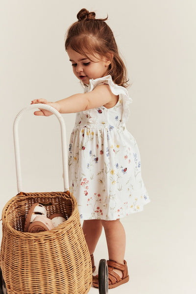 Baby white jersey dress with frill