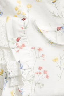 Baby white jersey dress with frill