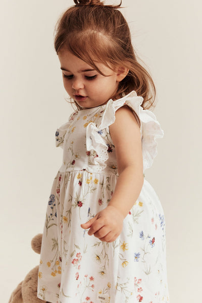 Baby white jersey dress with frill