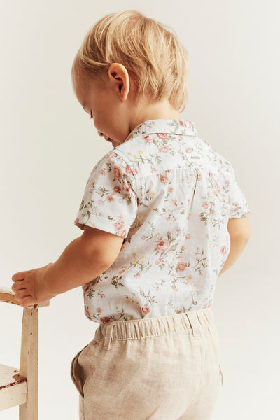Baby white floral short-sleeve bodysuit