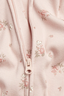 Baby pink floral sleepsuit with butterflies