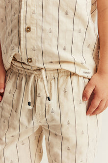 Kids cream striped trousers with sailboats