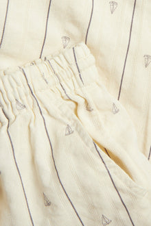 Kids cream striped trousers with sailboats