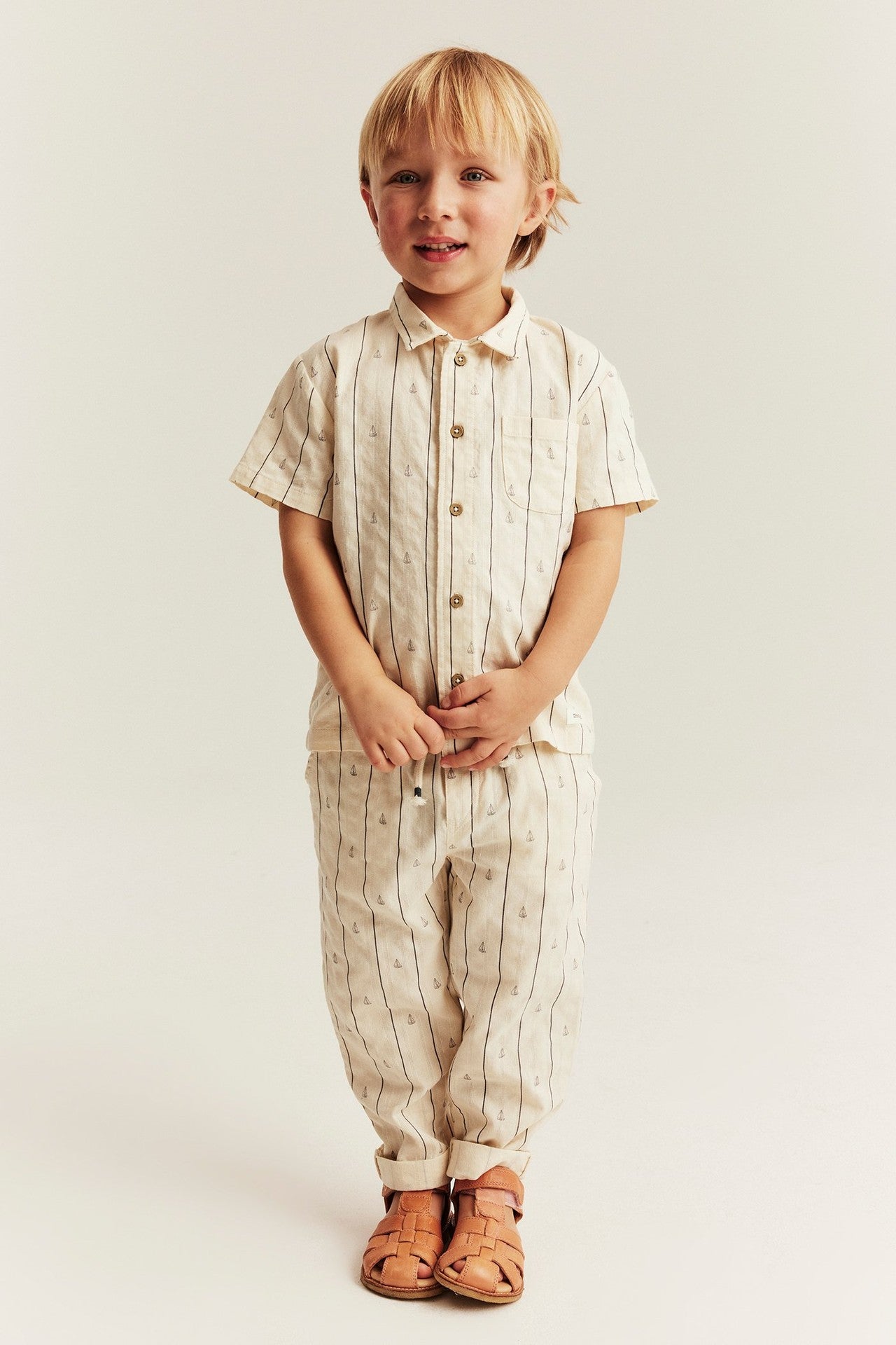 Kids cream striped trousers with sailboats