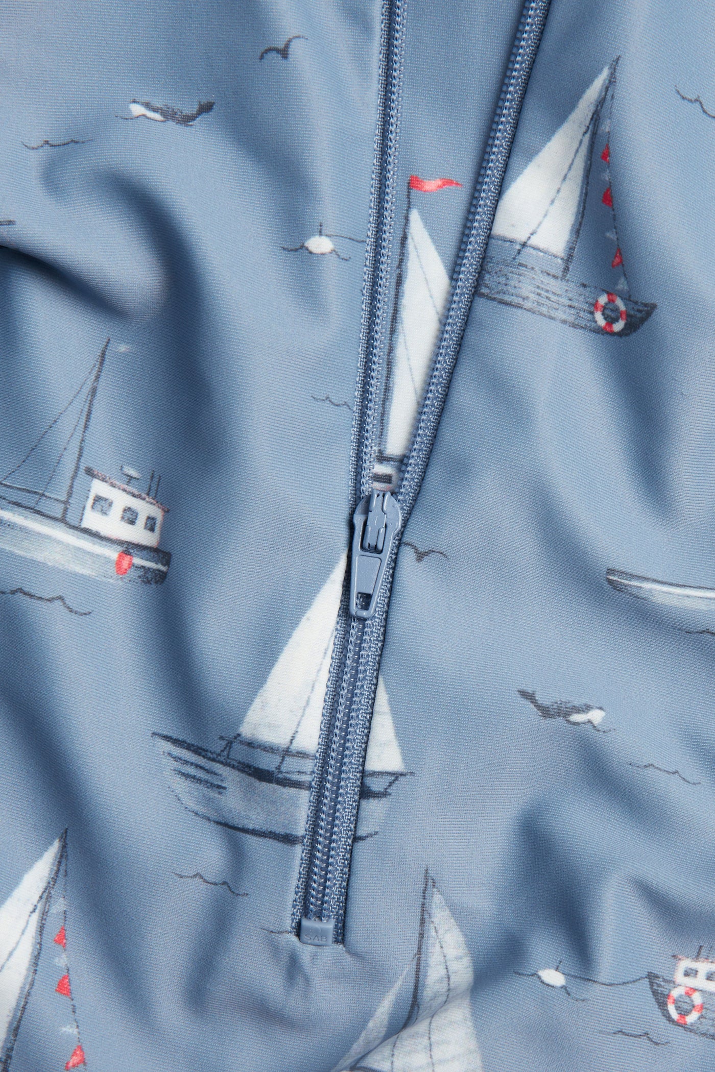 Baby & kids' blue UV suit with boat pattern